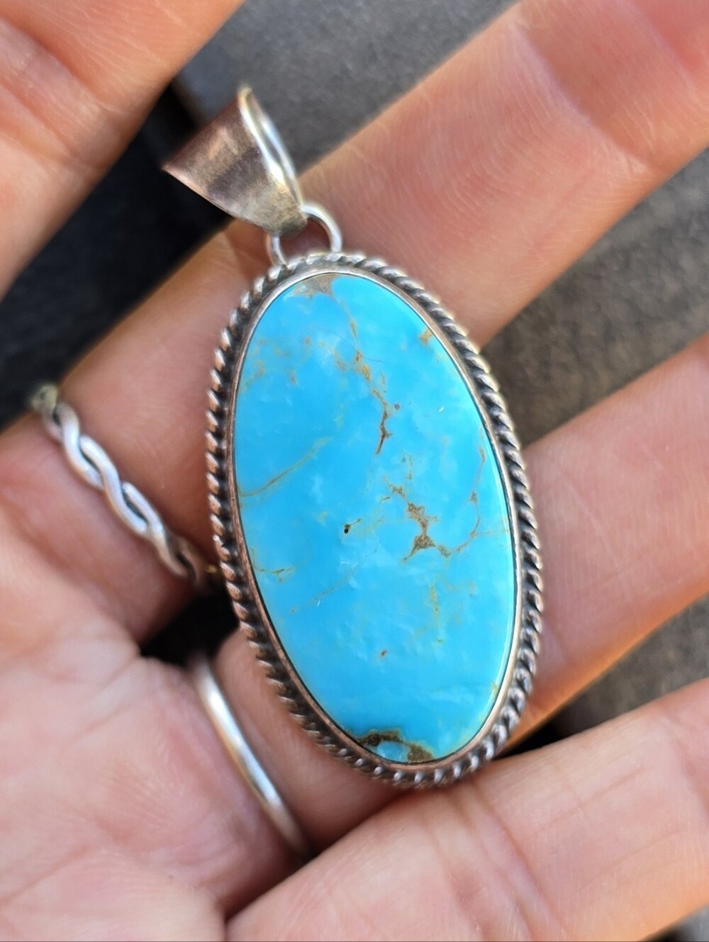 Native American signed 925 sterling silver oval turquoise rope border pendant